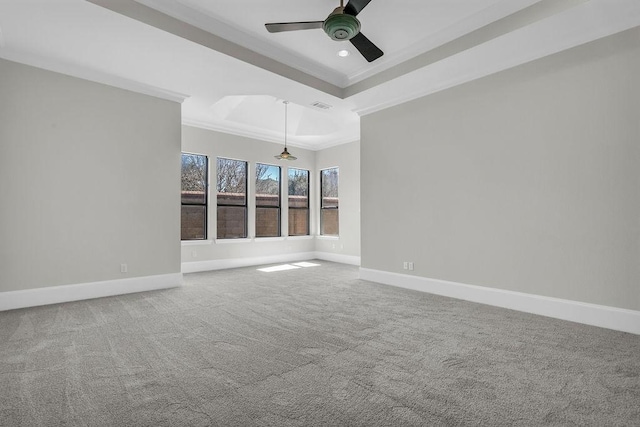 unfurnished room featuring visible vents, ornamental molding, carpet flooring, ceiling fan, and baseboards