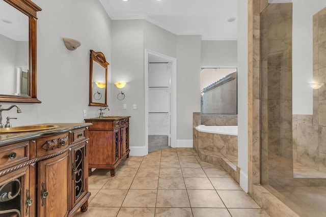 full bath featuring ornamental molding, tile patterned flooring, a sink, and a shower stall