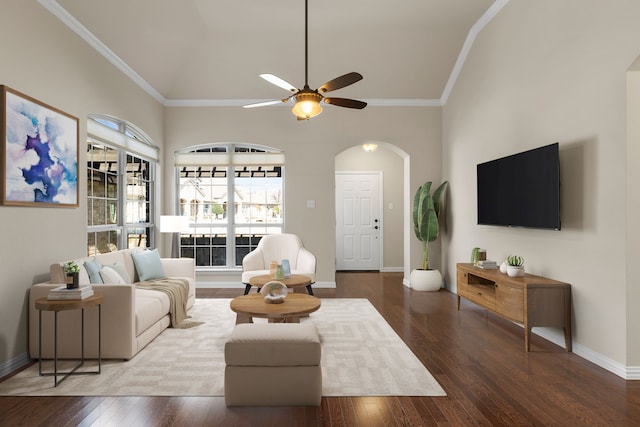 living area featuring hardwood / wood-style floors, crown molding, baseboards, and ceiling fan