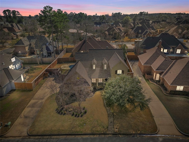 aerial view at dusk with a residential view