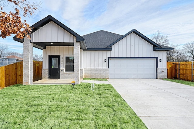 modern farmhouse with a garage and a front lawn