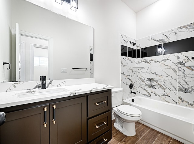 full bathroom with vanity, toilet, and tiled shower / bath