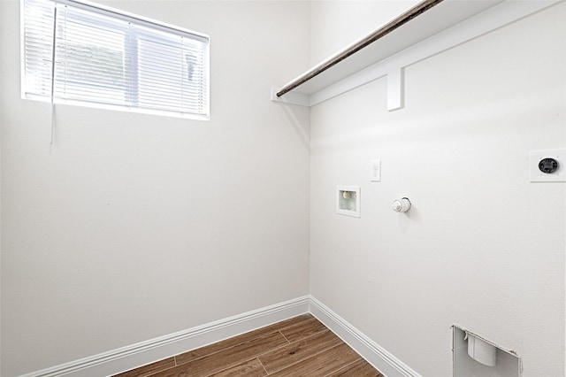 laundry room featuring hardwood / wood-style flooring, washer hookup, gas dryer hookup, and hookup for an electric dryer