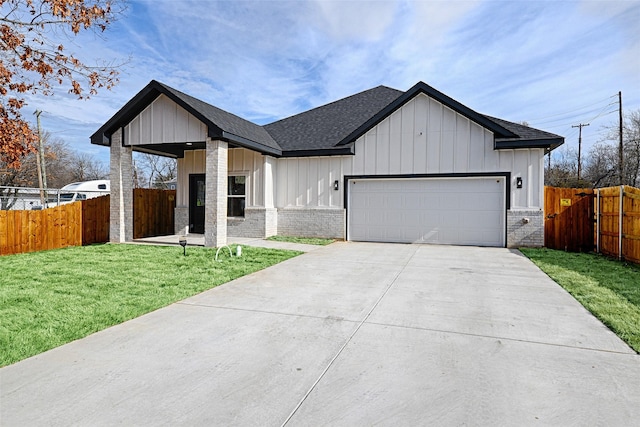 view of front of home featuring a garage and a front lawn