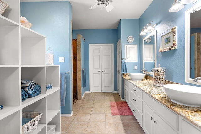 bathroom featuring tile patterned floors, ceiling fan, and vanity