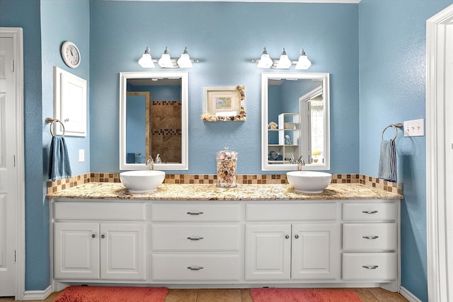 bathroom with backsplash and vanity