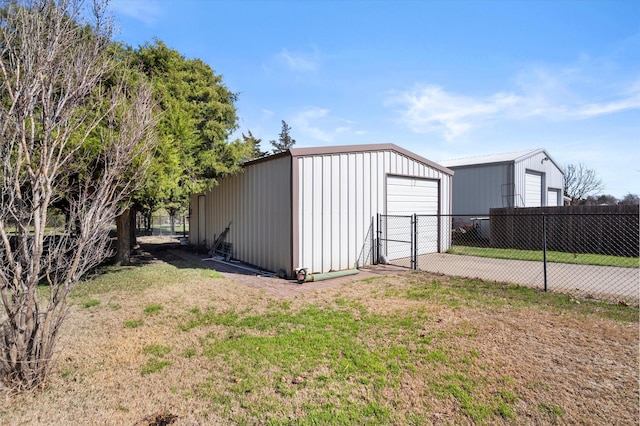 view of outdoor structure featuring a yard and a garage