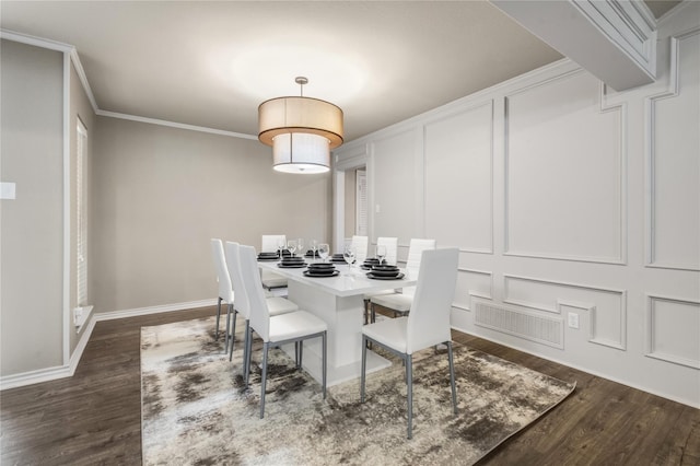 dining room featuring crown molding and dark hardwood / wood-style floors