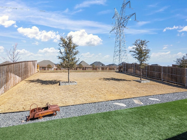 view of yard with a fenced backyard