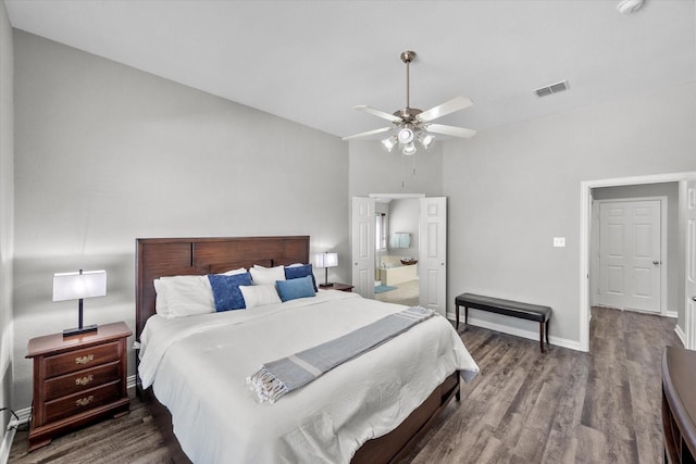 bedroom featuring a ceiling fan, baseboards, visible vents, and wood finished floors