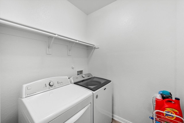 laundry area featuring washing machine and dryer and laundry area