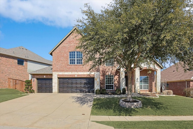 traditional-style house featuring a garage, concrete driveway, brick siding, and a front lawn