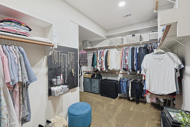 spacious closet featuring carpet flooring and visible vents