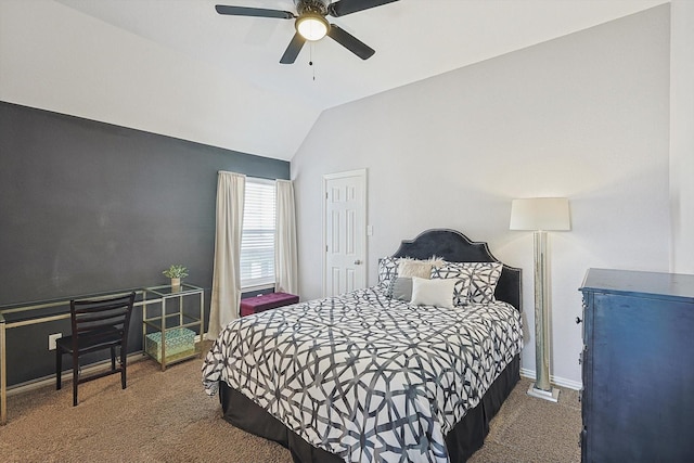 bedroom featuring baseboards, dark carpet, vaulted ceiling, and a ceiling fan