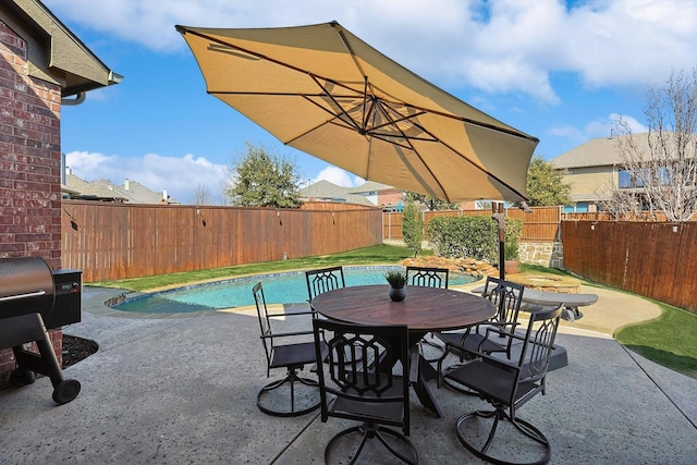 view of patio / terrace featuring a fenced backyard, a jacuzzi, grilling area, and a fenced in pool