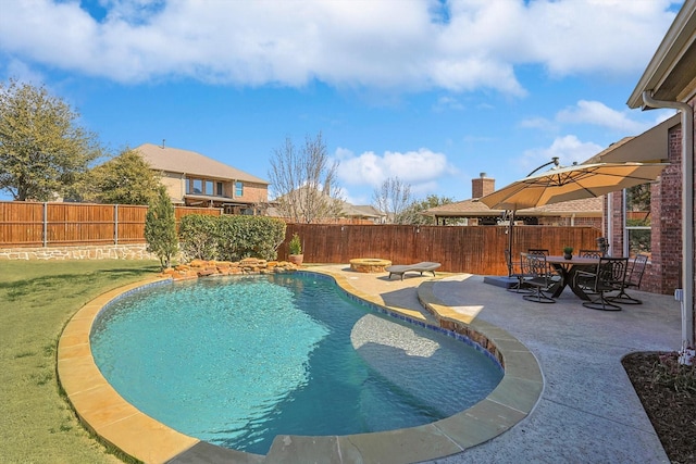 view of pool featuring an outdoor fire pit, a fenced backyard, and a patio