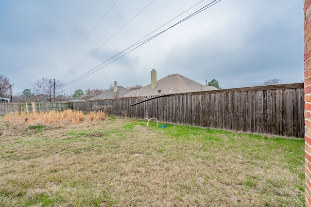 view of yard featuring a fenced backyard