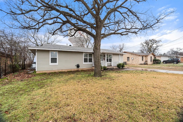 view of front of home featuring a front lawn and a porch