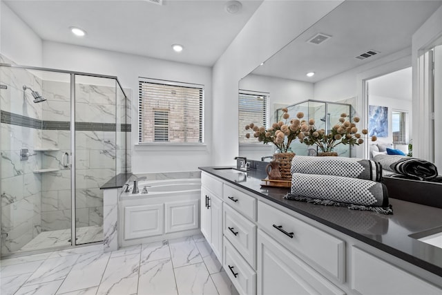 full bathroom with a garden tub, a sink, visible vents, marble finish floor, and a shower stall