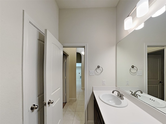 bathroom with tile patterned flooring and vanity