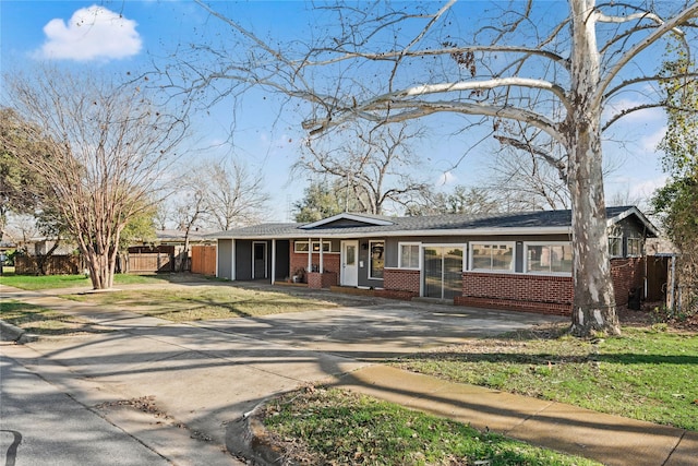 ranch-style house with a front lawn