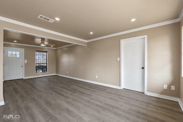 spare room featuring hardwood / wood-style floors, crown molding, and ceiling fan