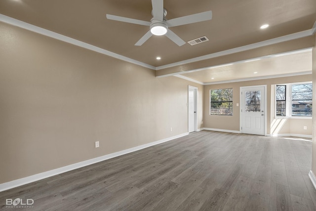 spare room with ceiling fan, hardwood / wood-style flooring, and crown molding