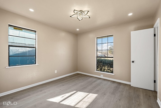 spare room featuring light wood-type flooring