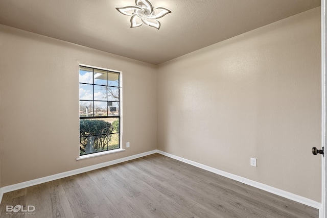 unfurnished room featuring wood-type flooring