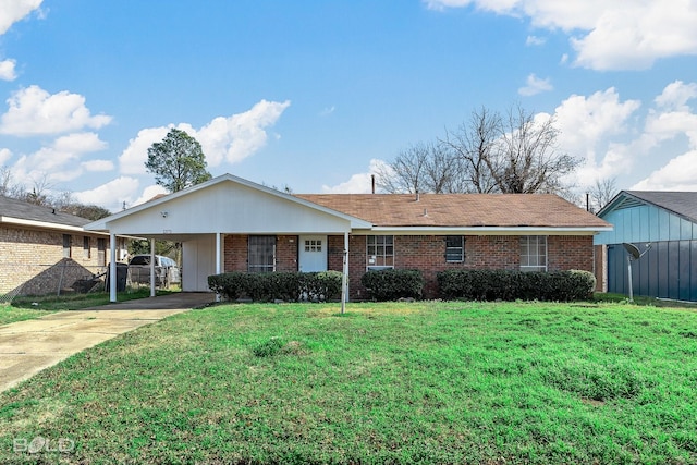 single story home featuring a front lawn and a carport