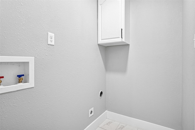 laundry area featuring cabinets, washer hookup, and electric dryer hookup