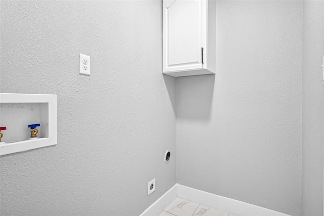 3126 Colchester Dr, Farmers Branch, TX 75234 - laundry area with cabinet space, electric dryer hookup, light marble finish floors, baseboards, and hookup for a washing machine