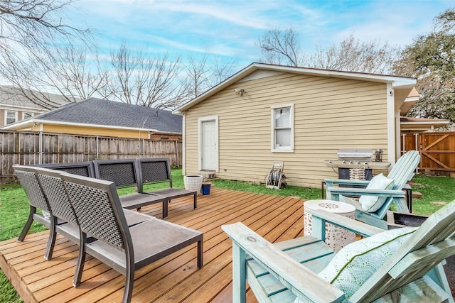 wooden terrace with fence and grilling area