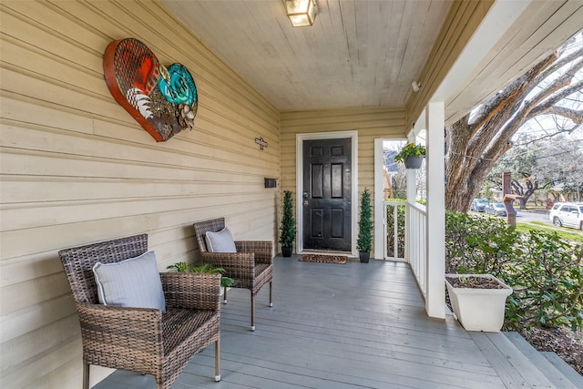 doorway to property with a porch