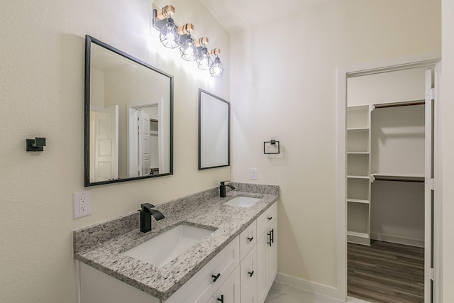 bathroom featuring hardwood / wood-style flooring and vanity