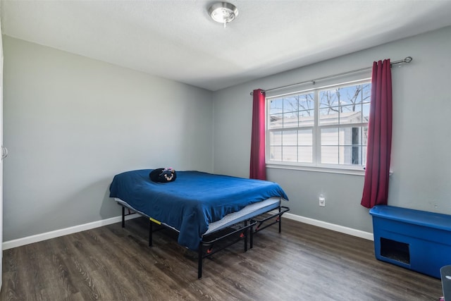 bedroom featuring dark hardwood / wood-style flooring