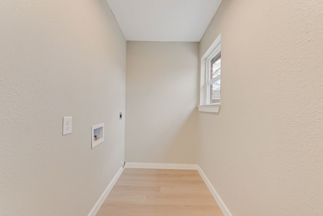 laundry area featuring light hardwood / wood-style flooring, washer hookup, and electric dryer hookup