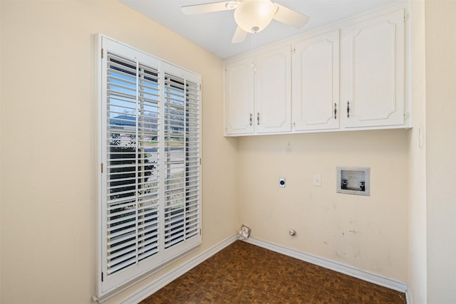 clothes washing area with dark parquet flooring, hookup for a washing machine, ceiling fan, electric dryer hookup, and cabinets