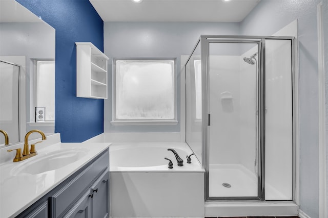 bathroom featuring separate shower and tub and vanity