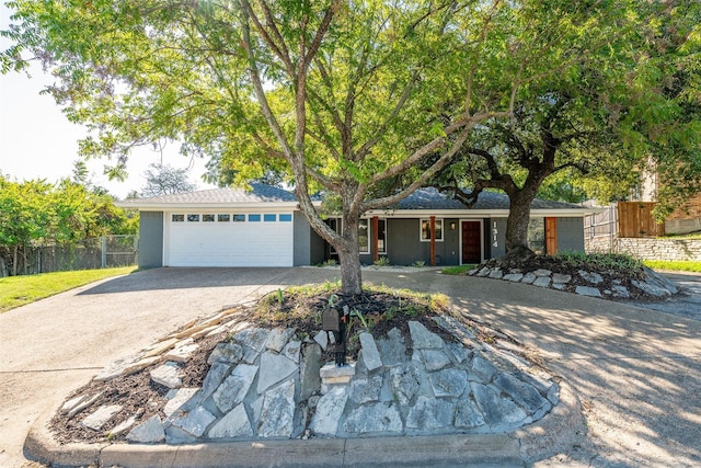 ranch-style home with a garage