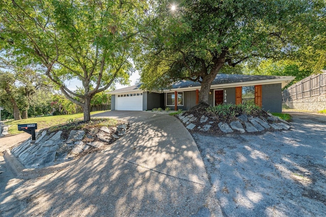 ranch-style home featuring a garage