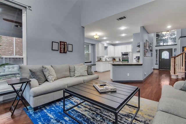 living room with dark hardwood / wood-style floors