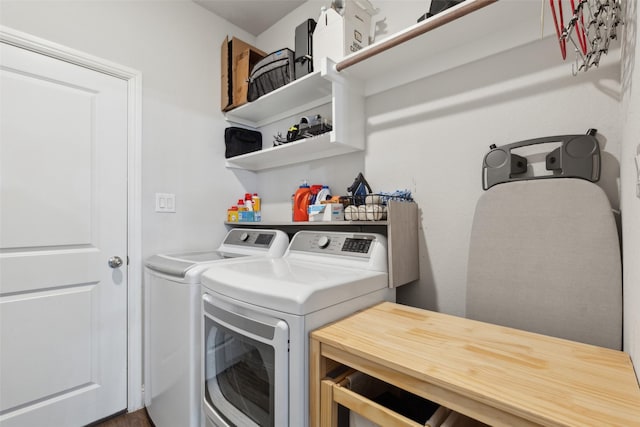 clothes washing area featuring washer and dryer