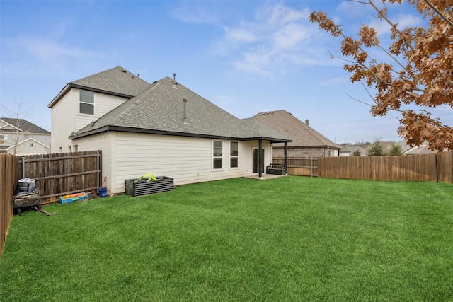 rear view of house with a yard