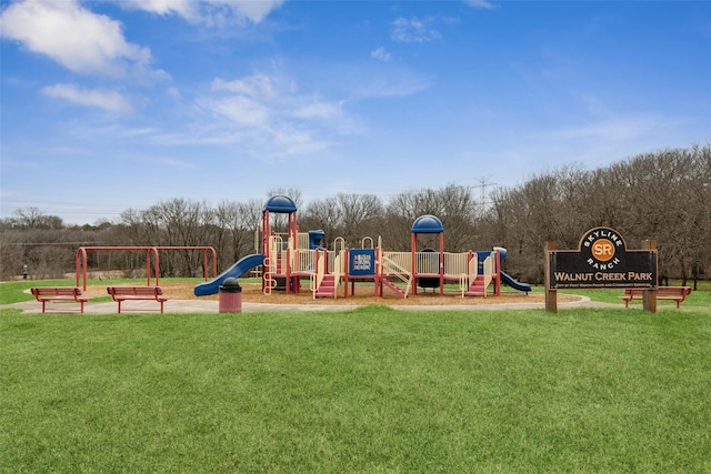 view of jungle gym with a lawn