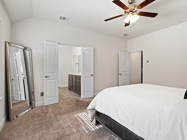 bedroom with light carpet, baseboards, visible vents, a ceiling fan, and lofted ceiling