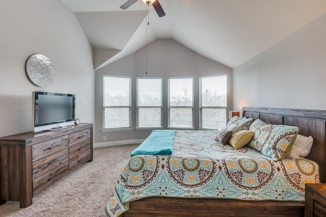 bedroom with ceiling fan, vaulted ceiling, light colored carpet, and baseboards