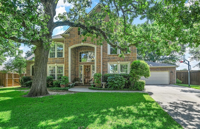 view of front of home featuring a front lawn and a garage