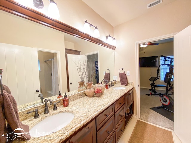 bathroom featuring visible vents, a sink, bathing tub / shower combination, and double vanity