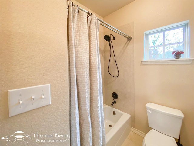 bathroom with shower / bathtub combination with curtain and toilet